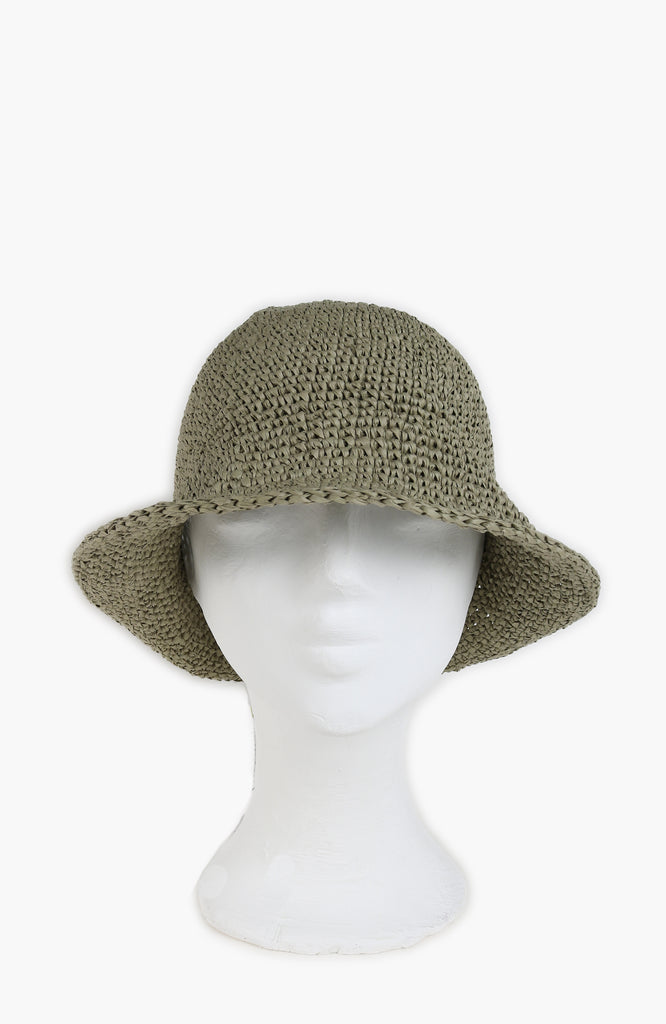 a crochet paper sun hat in tarragon colour from Karakoram Accessories shown on a white mannequin's head