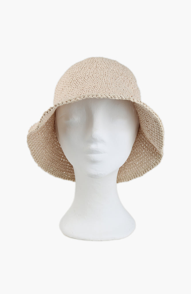  a crochet paper sun hat in ivory colour from Karakoram Accessories shown on a hat white mannequin head