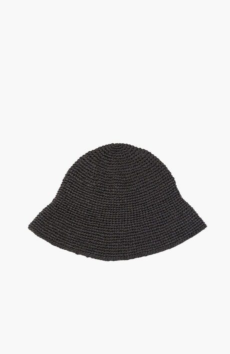 a crochet paper sun hat in charcoal colour from Karakoram Accessories lying flat on white background