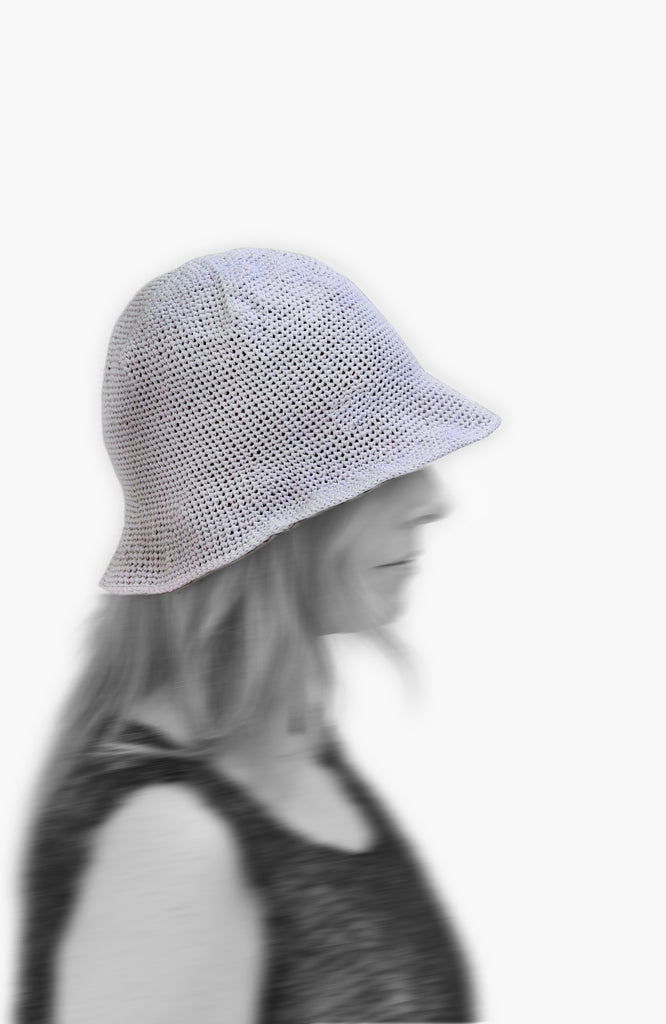 model wearing crochet bell hat in lavender colour from Karakoram Accessories