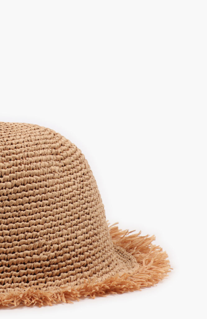 a close up of a crochet paper sun hat with fringed brim  in oak colour from Karakoram Accessories